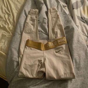 Nike Pro leggings with gold design